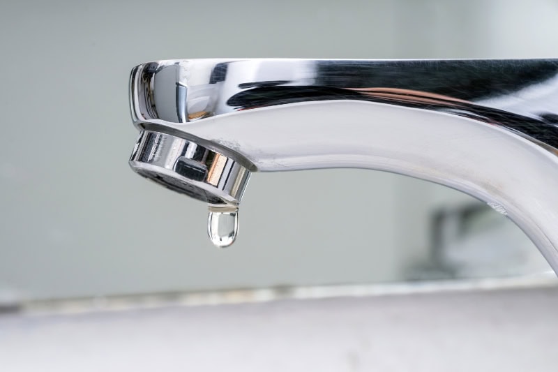 What Problems Can a Leaky Faucet Cause? Drop of water falling from faucet. Water supply cuts due to drought. Severe restrictions measures for water saving. Increase in prices and taxes on the water bill.